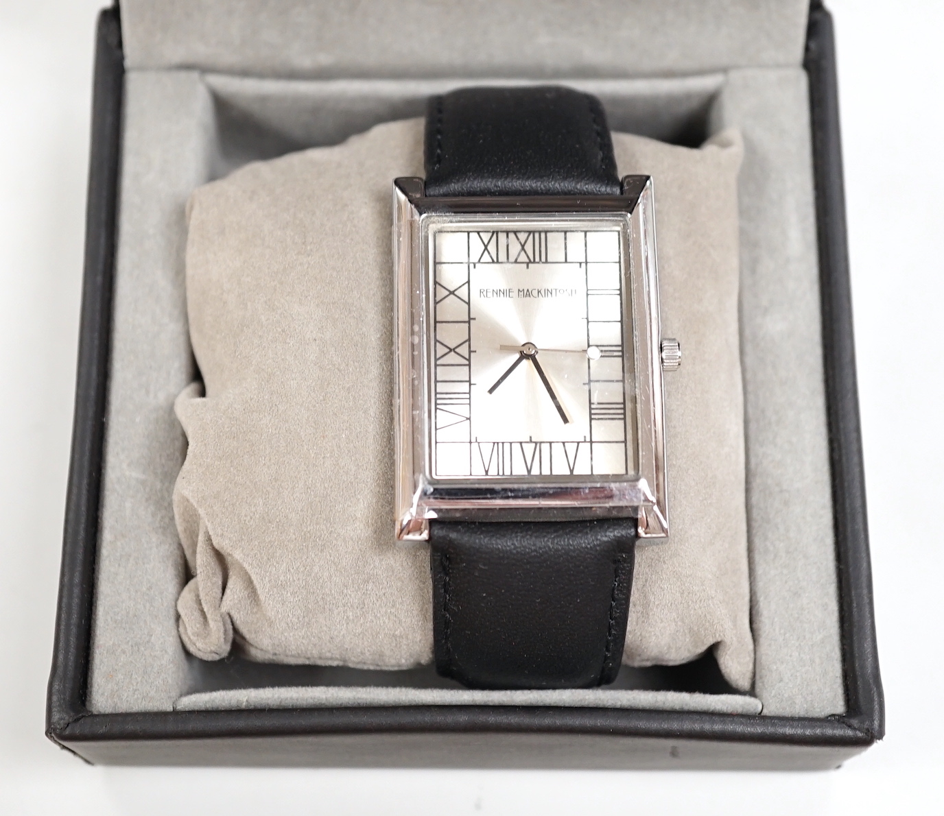 A gentleman's modern stainless steel 'Rennie Mackintosh' quartz square dial wrist watch, with original box and pamphlets.